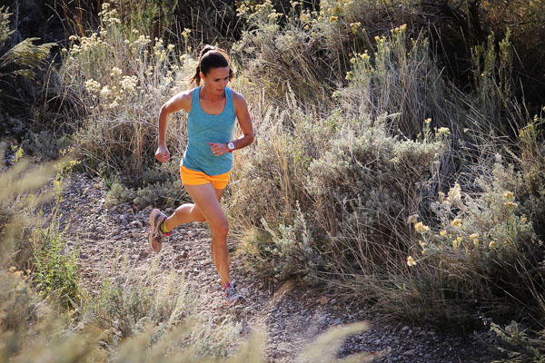 Cynthia Fowler running on a trail in the Ogden area